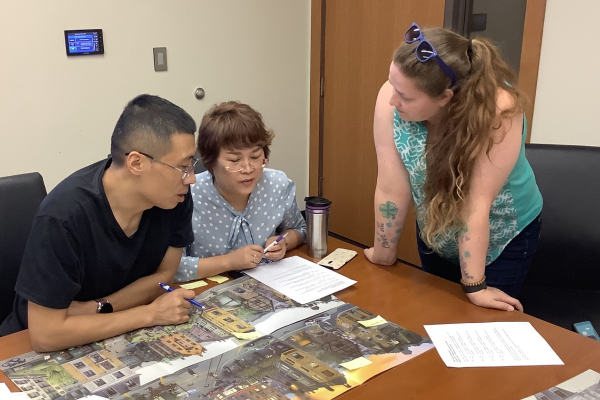 CUMT faculty and CELT staff examining a pictorial representation