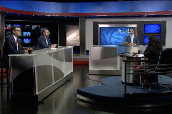 KET Kentucky Tonight studio with guests seated behind high tables and host seated at a desk