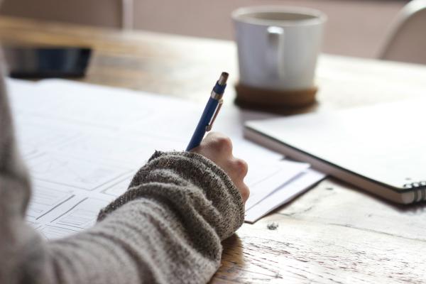 Image of student taking notes