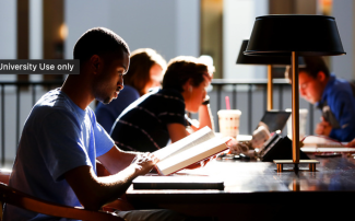 Students in profile studying at a table
