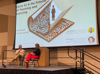 two speakers sitting on stage with a slide reading "GenAI and the futures of teaching and learning"