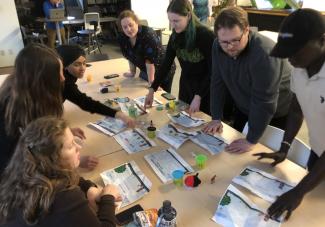 Participants in the Pedagogy of Play workshop collaborate together.