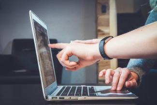 Students using a computer.